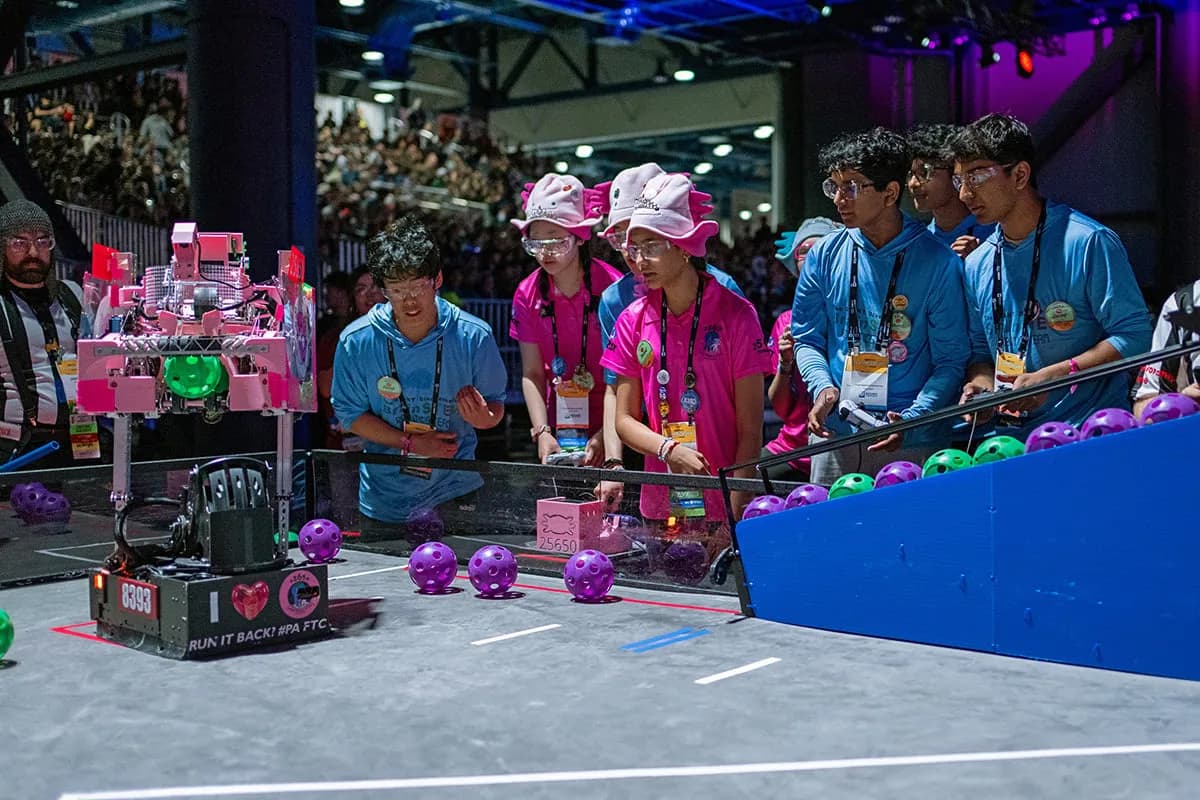 FIRST Tech Challenge teams and robots competing on the championship field